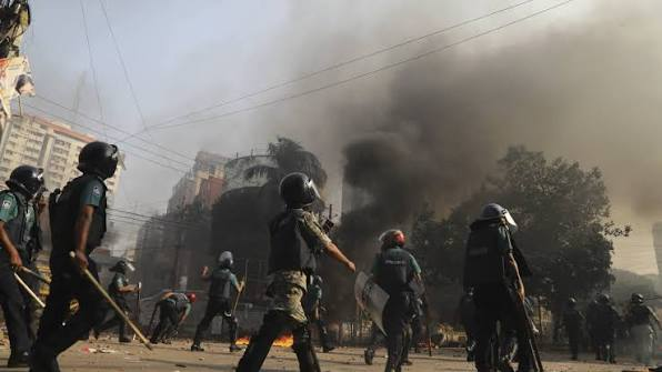 Protesters and police during a confrontation in Dhaka