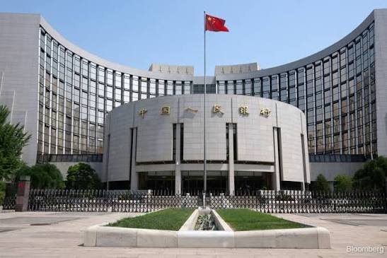 Exterior of People’s Bank of China building in Beijing at dusk