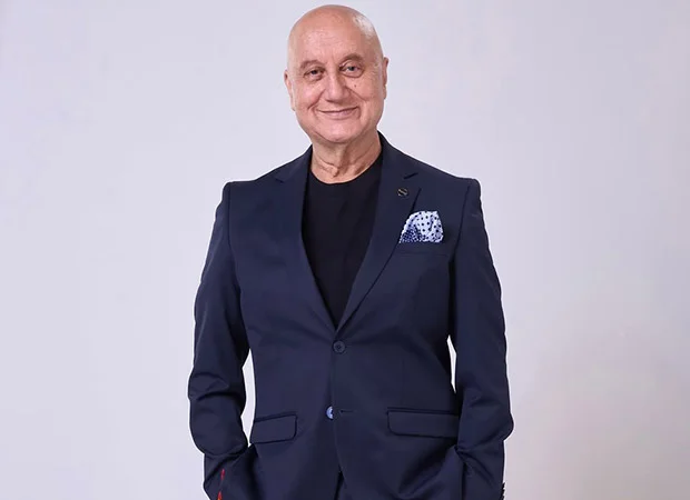 Anupam Kher holding a Certificate of Recognition in Toronto