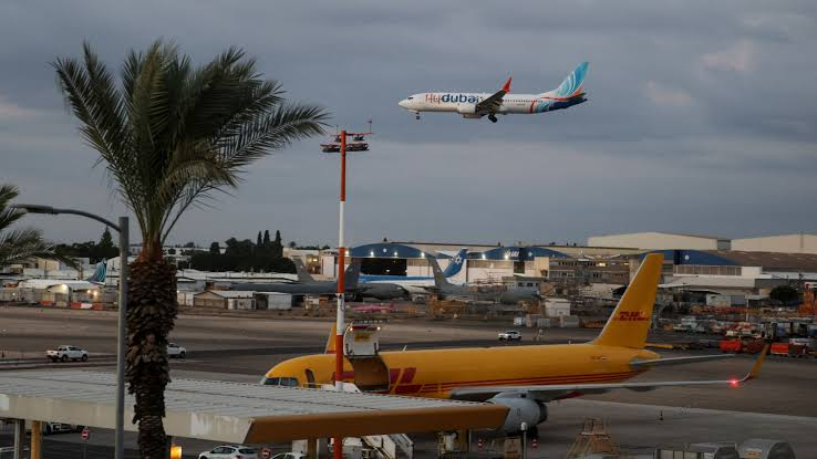 Passengers deplaning after emergency landing following cockpit struggle